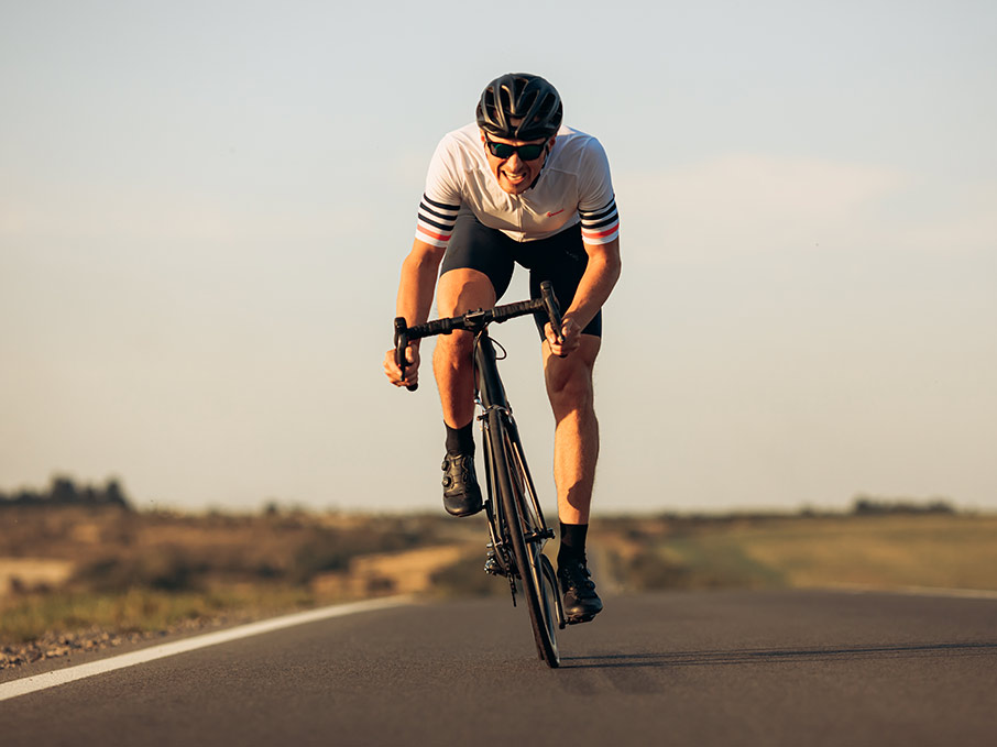 Cyclist on an open road